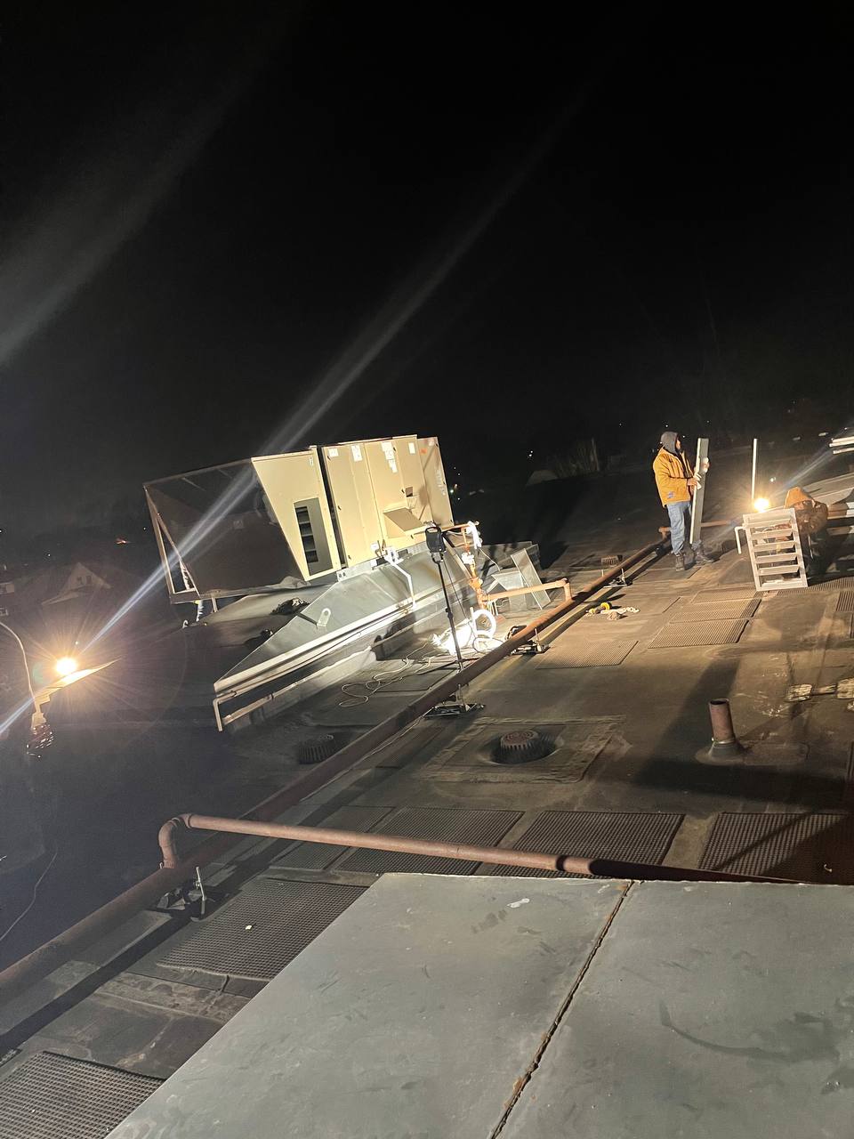 AH-CHOO crew on rooftop servicing commercial HVAC unit overnight