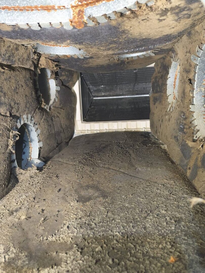 Contaminated residential plenum before cleaning