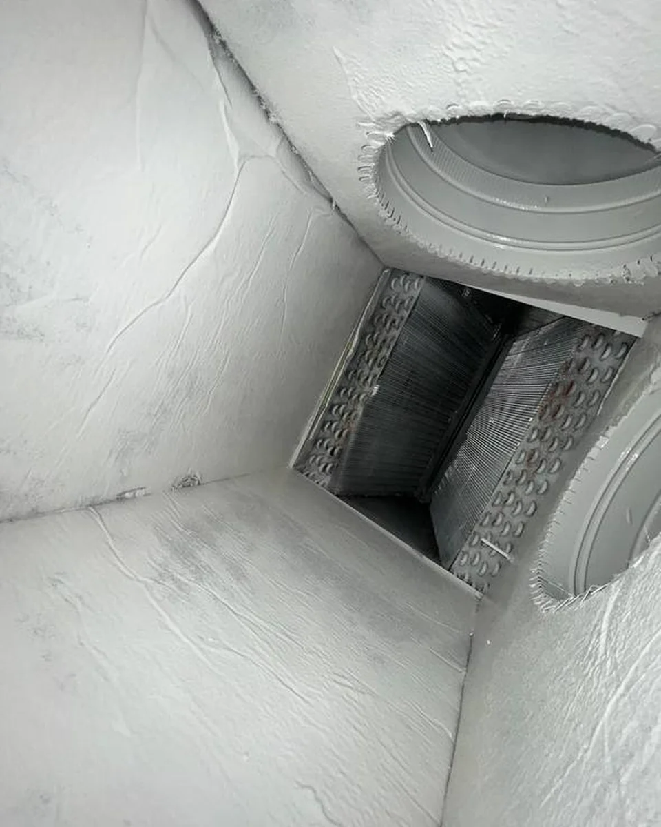 The same HVAC plenum interior after AH-CHOO service, visibly clean and uniformly finished